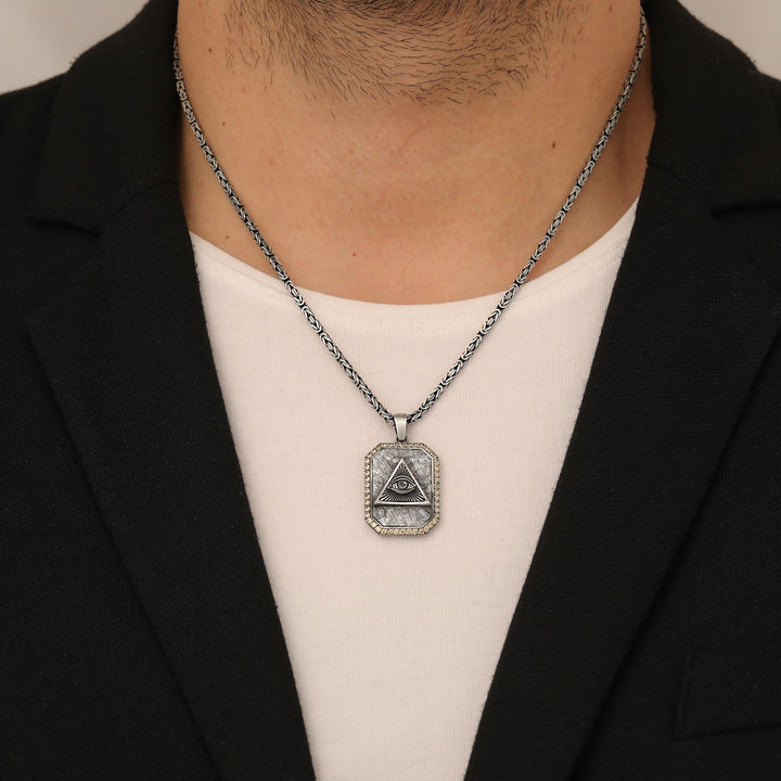 Person wearing a necklace with an Occult Sterling Silver Eye Necklace.