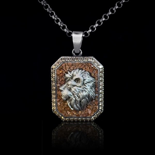 Mosaic stone pendant necklace with a detailed lion head design on a black background